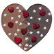 Dark and milk chocolate heart with raspberries